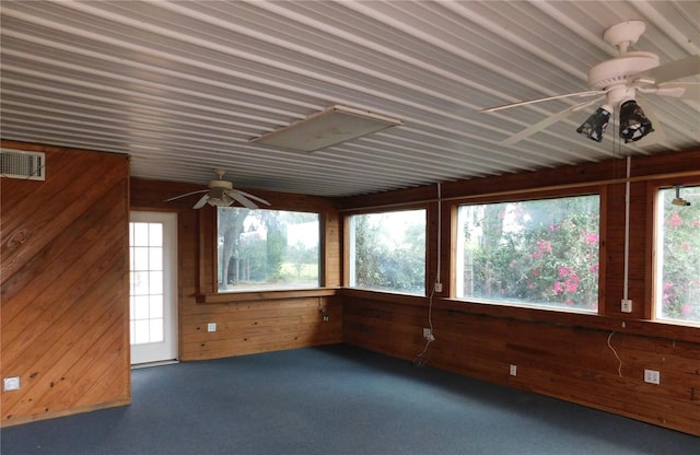unfurnished sunroom with visible vents