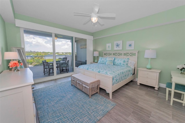 bedroom with access to outside, wood finished floors, baseboards, and ceiling fan
