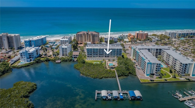 birds eye view of property featuring a city view and a water view