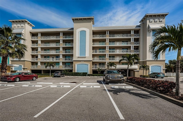 view of property featuring uncovered parking