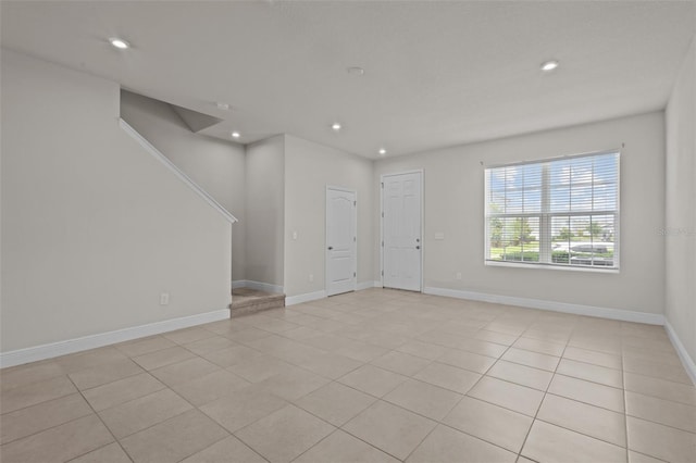 2432 Hearth Dr, Odessa, FL 33556 - empty room featuring recessed lighting, light tile patterned floors, stairs, and baseboards