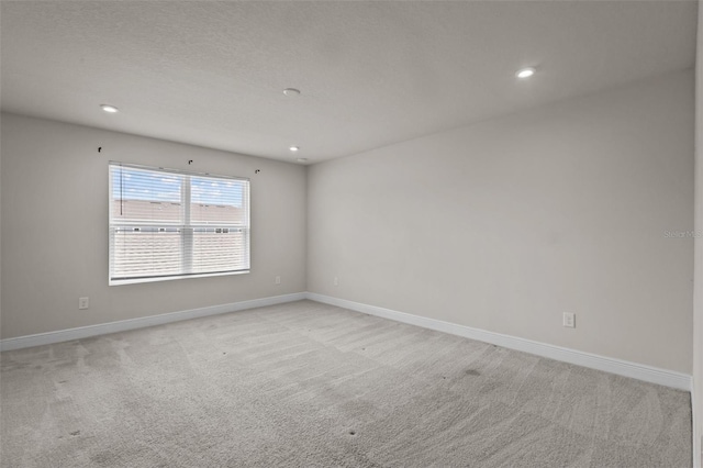 2432 Hearth Dr, Odessa, FL 33556 - empty room featuring light carpet, recessed lighting, and baseboards