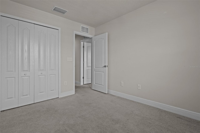 2432 Hearth Dr, Odessa, FL 33556 - unfurnished bedroom featuring carpet, baseboards, and a closet