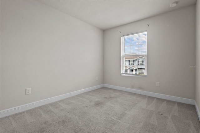 2432 Hearth Dr, Odessa, FL 33556 - carpeted spare room with baseboards and a smoke detector