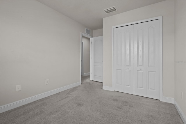 2432 Hearth Dr, Odessa, FL 33556 - unfurnished bedroom with carpet, baseboards, and a closet