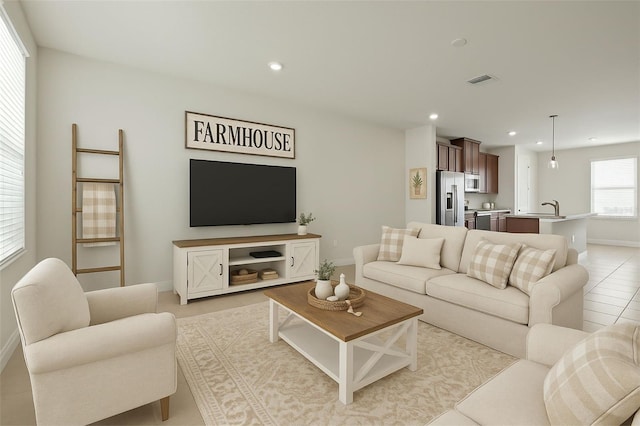 2432 Hearth Dr, Odessa, FL 33556 - living room featuring baseboards, recessed lighting, and light tile patterned floors