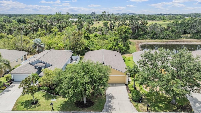 birds eye view of property featuring a water view and a residential view