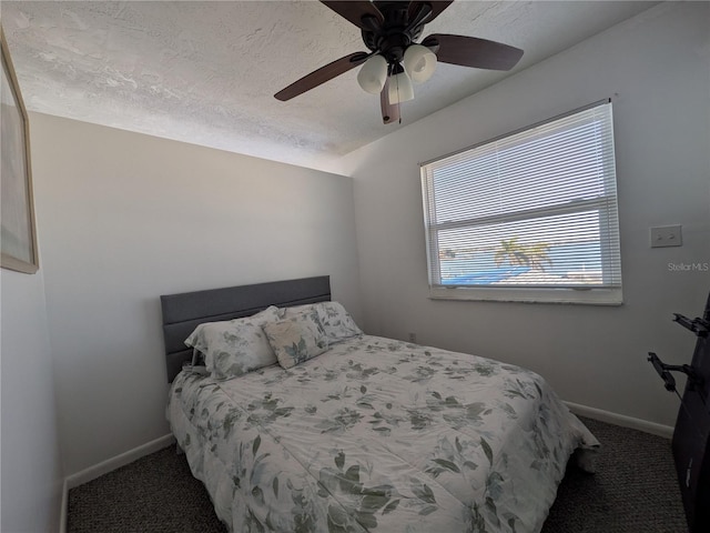 5930 Bahama Way N, St Pete Beach, FL 33706 - bedroom with carpet floors, baseboards, and ceiling fan