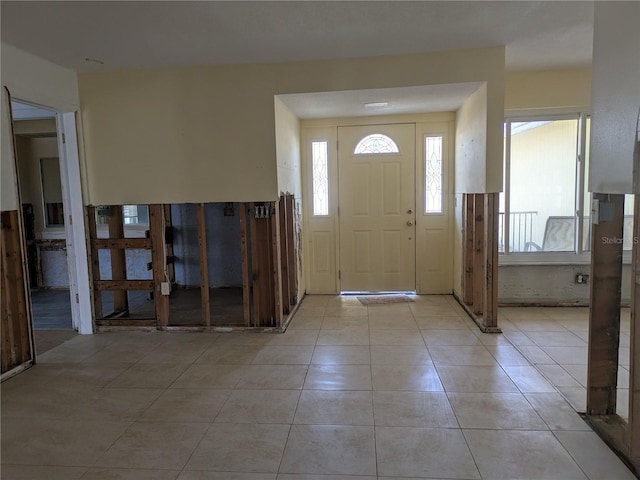 5930 Bahama Way N, St Pete Beach, FL 33706 - entryway with healthy amount of natural light and light tile patterned floors