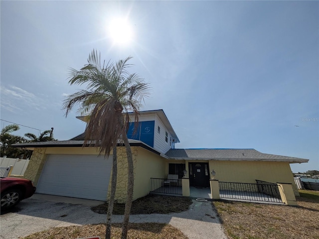 5930 Bahama Way N, St Pete Beach, FL 33706 - view of front of property featuring driveway and stone siding