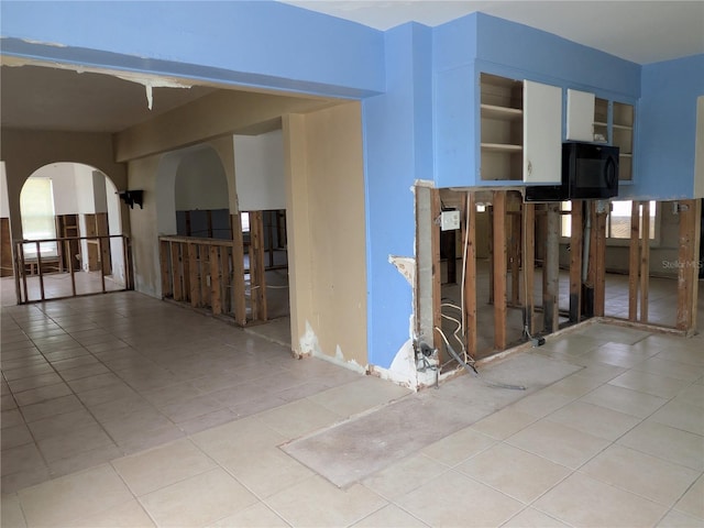 5930 Bahama Way N, St Pete Beach, FL 33706 - hallway featuring tile patterned flooring and arched walkways