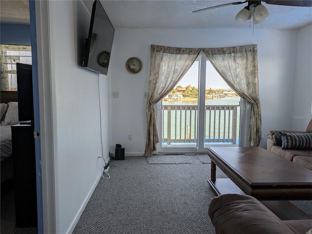 5930 Bahama Way N, St Pete Beach, FL 33706 - carpeted living area featuring ceiling fan and baseboards