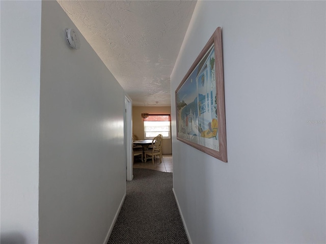 5930 Bahama Way N, St Pete Beach, FL 33706 - corridor with a textured ceiling, baseboards, and carpet floors