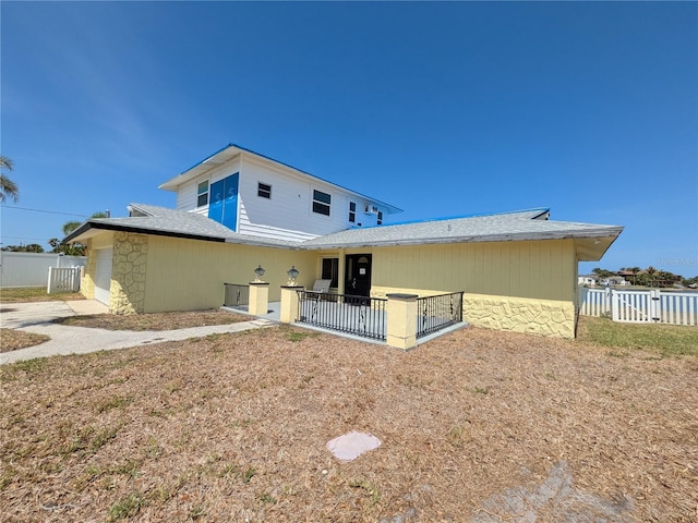 5930 Bahama Way N, St Pete Beach, FL 33706 - rear view of property featuring stone siding