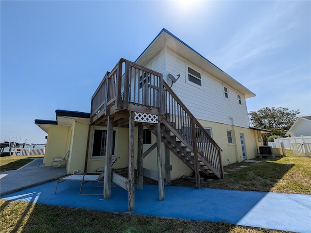 5930 Bahama Way N, St Pete Beach, FL 33706 - back of house featuring a patio, cooling unit, stairway, and a wooden deck