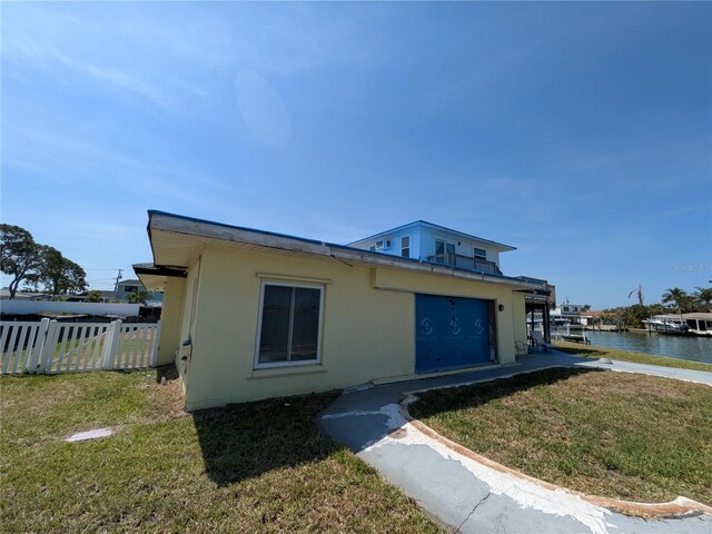 5930 Bahama Way N, St Pete Beach, FL 33706 - view of front of home featuring stucco siding and a water view