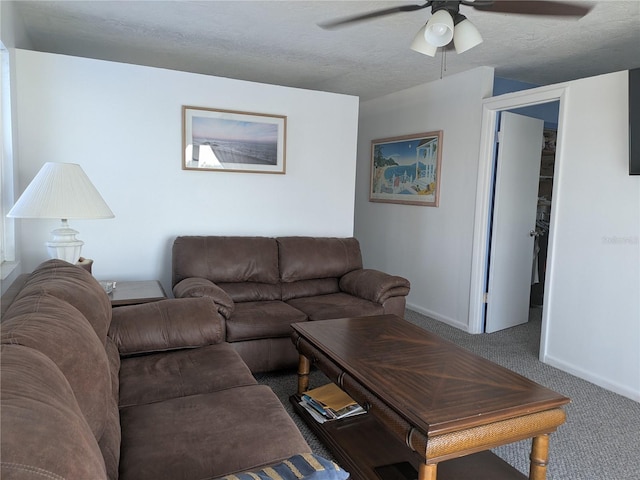 5930 Bahama Way N, St Pete Beach, FL 33706 - carpeted living room featuring a ceiling fan, baseboards, and a textured ceiling