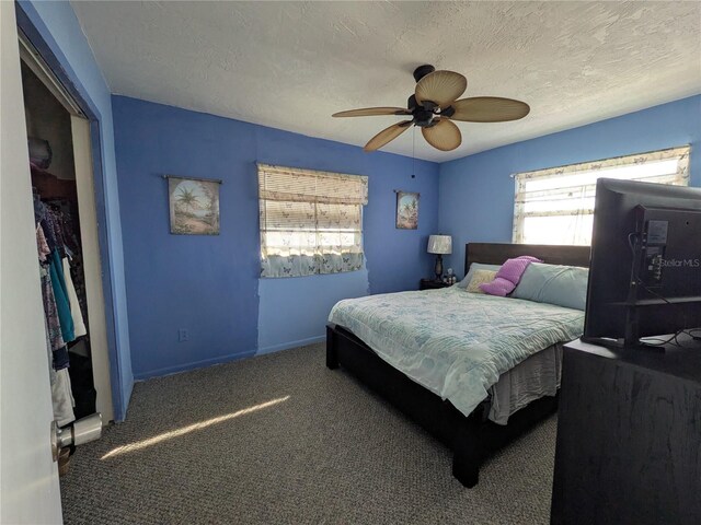 5930 Bahama Way N, St Pete Beach, FL 33706 - bedroom with carpet, baseboards, a ceiling fan, and a textured ceiling