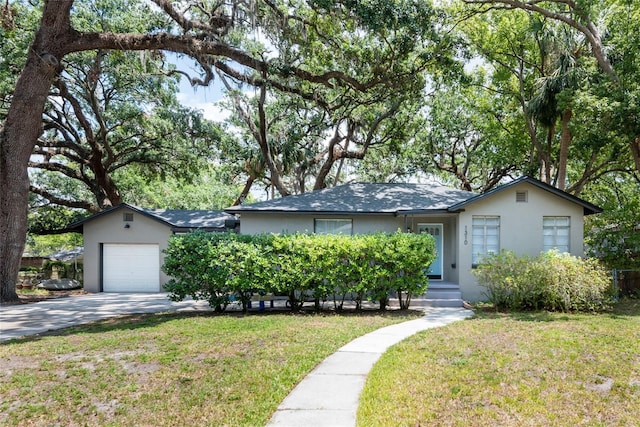 1310 Hilton Pl, Tampa, FL 33604 - single story home featuring driveway, stucco siding, a front yard, and an attached garage