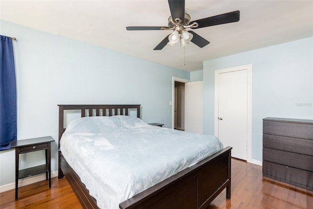 1310 Hilton Pl, Tampa, FL 33604 - bedroom featuring baseboards, a ceiling fan, a closet, and wood finished floors