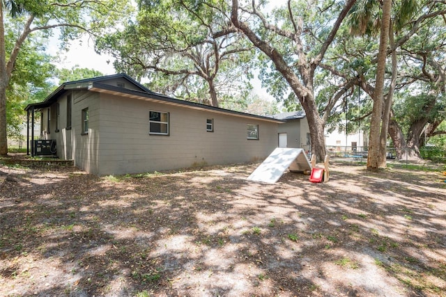 1310 Hilton Pl, Tampa, FL 33604 - rear view of house featuring central air condition unit
