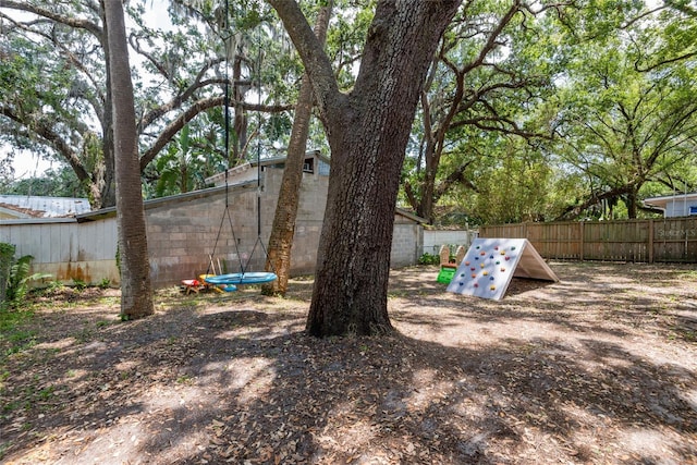 1310 Hilton Pl, Tampa, FL 33604 - view of yard with a trampoline and fence
