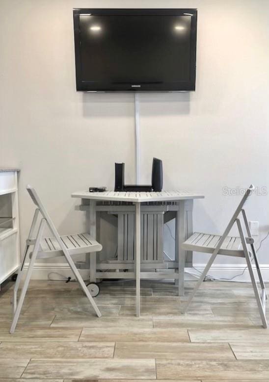 details with baseboards and wood finished floors