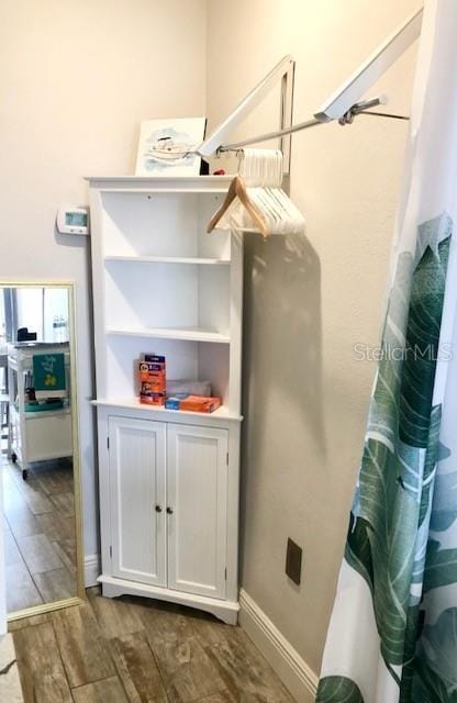 interior details with wood finished floors and baseboards