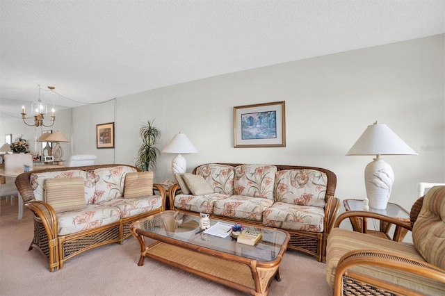 carpeted living area with a chandelier and a textured ceiling