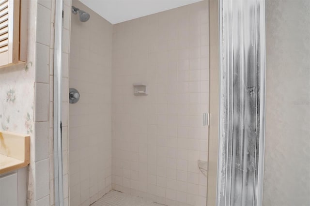 bathroom with vanity and a shower stall
