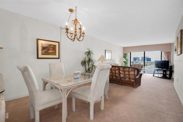 dining area with light colored carpet and an inviting chandelier