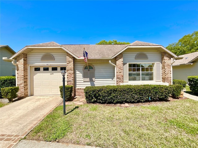 4740 Carrington Ct Unit 4740, New Port Richey, FL 34655 - single story home with brick siding, driveway, a garage, roof with shingles, and a front yard