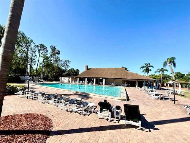 4740 Carrington Ct Unit 4740, New Port Richey, FL 34655 - community pool featuring a patio area