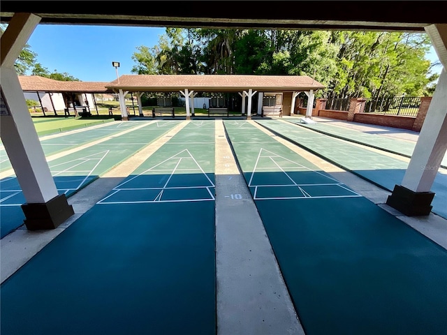 4740 Carrington Ct Unit 4740, New Port Richey, FL 34655 - view of community with fence and shuffleboard