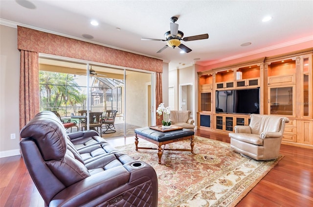 3300 Stonegate Falls Dr, Land O Lakes, FL 34638 - living area with crown molding, a ceiling fan, wood finished floors, recessed lighting, and baseboards
