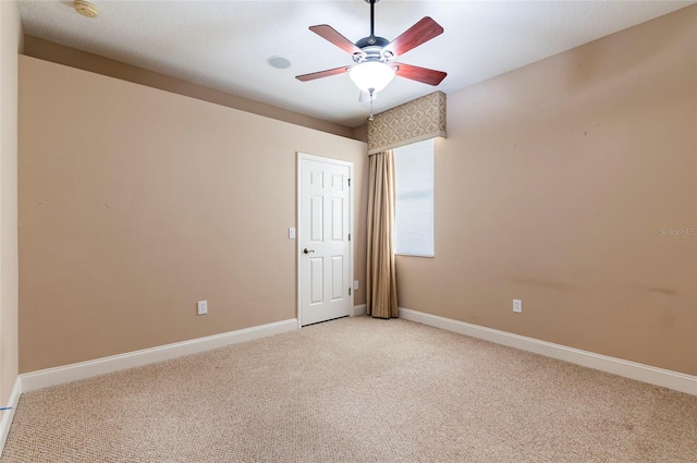 3300 Stonegate Falls Dr, Land O Lakes, FL 34638 - empty room with light carpet, ceiling fan, baseboards, and a smoke detector