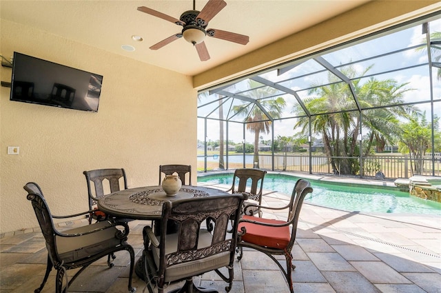 3300 Stonegate Falls Dr, Land O Lakes, FL 34638 - view of patio / terrace with ceiling fan, a lanai, a water view, and a pool with connected hot tub