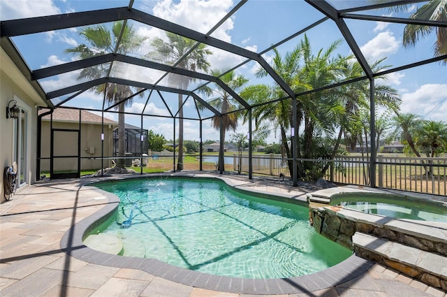 3300 Stonegate Falls Dr, Land O Lakes, FL 34638 - view of pool featuring a patio, a water view, glass enclosure, and a pool with connected hot tub
