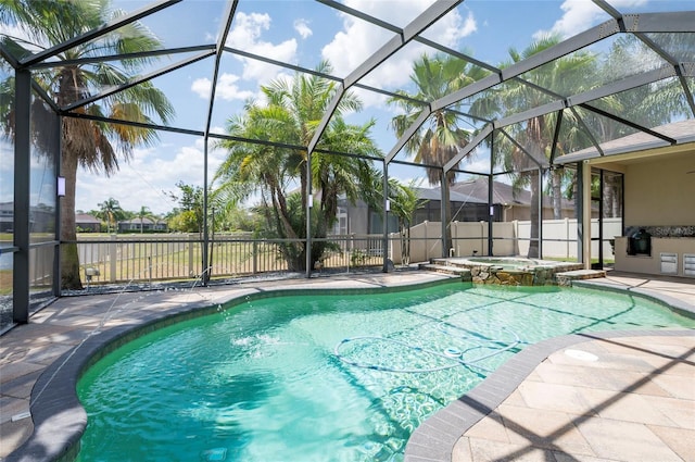 3300 Stonegate Falls Dr, Land O Lakes, FL 34638 - view of swimming pool with a patio, a lanai, and a pool with connected hot tub