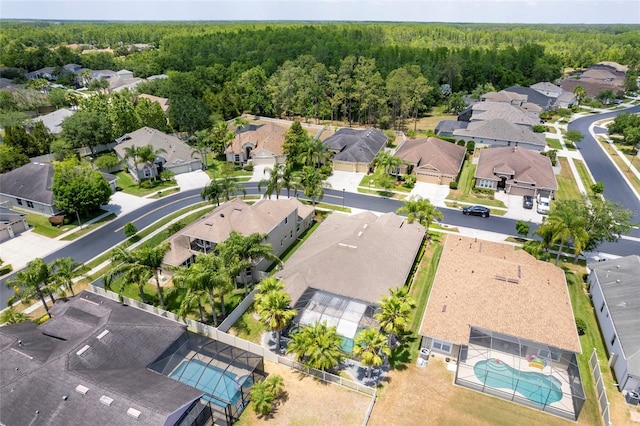 3300 Stonegate Falls Dr, Land O Lakes, FL 34638 - aerial view of residential area featuring a heavily wooded area and a pool area