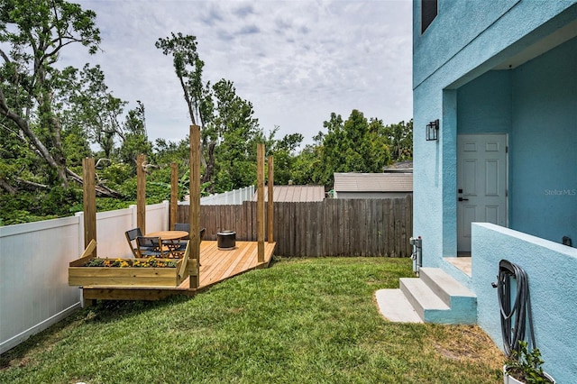 view of yard with a wooden deck