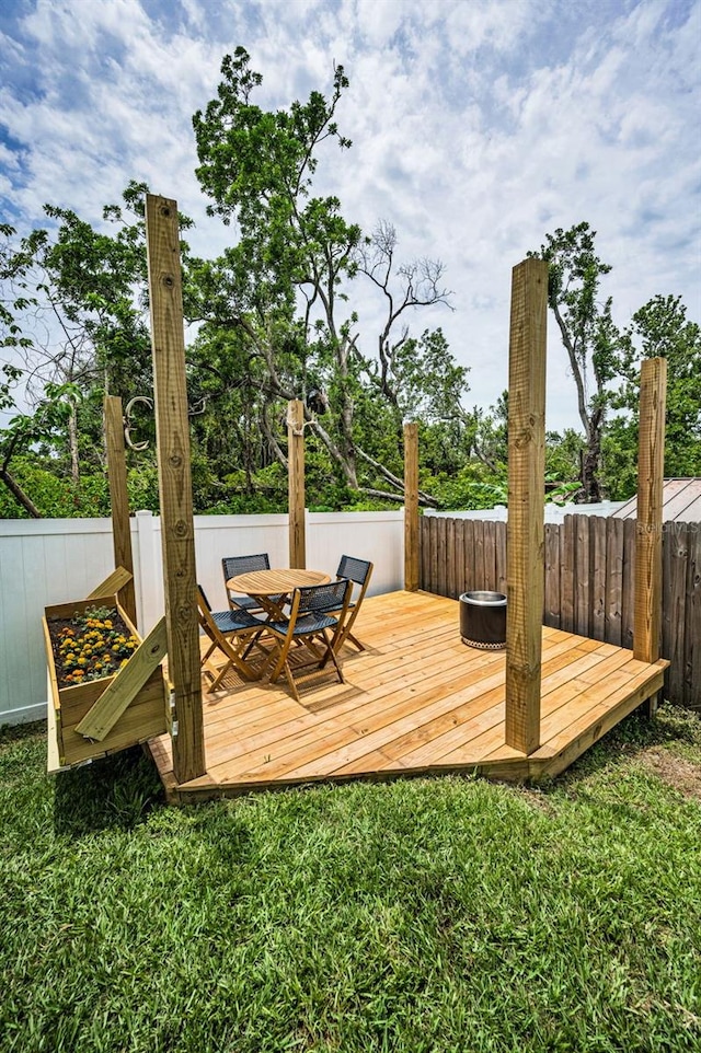 wooden deck with outdoor dining area