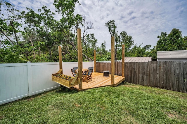 view of yard featuring a wooden deck