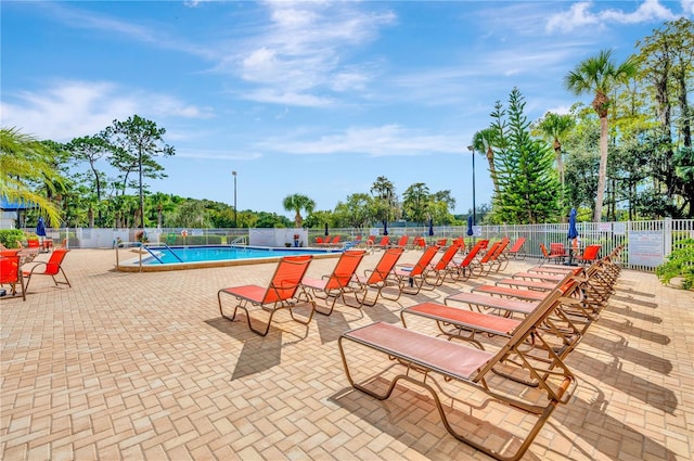 11723 Boynton Ln Unit 1, New Port Richey, FL 34654 - community pool featuring fence and a patio area