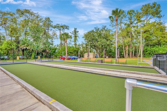 11723 Boynton Ln Unit 1, New Port Richey, FL 34654 - view of community featuring a bocce ball area, view of wooded area, and fence
