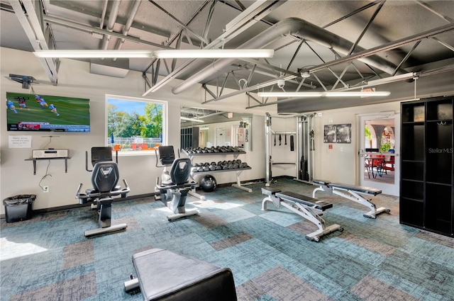 11723 Boynton Ln Unit 1, New Port Richey, FL 34654 - exercise room featuring baseboards and carpet floors