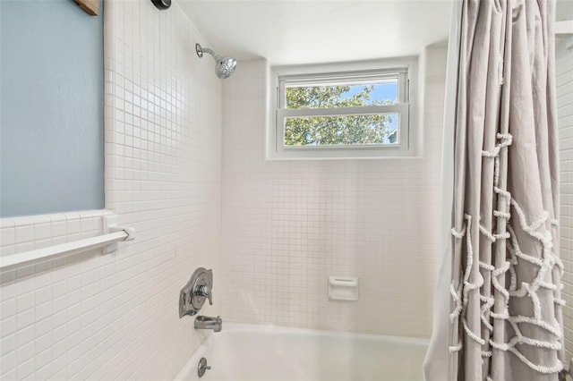 bathroom with shower / tub combo