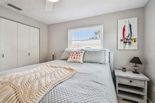 bedroom featuring a closet and a ceiling fan
