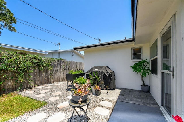 view of patio / terrace featuring fence and area for grilling