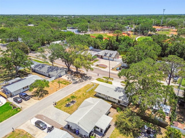 aerial view of residential area with a forest